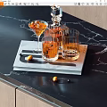 Stylish Wine Decanter And Cocktail Glasses On Tray With Marble Tabletop And Fruit Garnish
