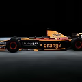 Black and Orange Formula 1 Race Car With Orange ABATECH LOTOS Sponsor Logos