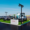 Outdoor Vehicle Display Event With Multiple Cars On Grass And Decorative Lights