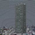 Aerial Planning of Tall Glass Curtain Wall Skyscraper with Sunset and Urban Buildings