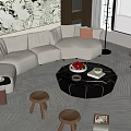 Beige Curved Sofa and Black Round Coffee Table Set with Wooden Stools and Floor Lamp