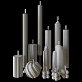Textured White Candles in Various Shapes and Heights with Lit Wicks