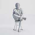 Man sitting on stool holding cup wearing white shirt shorts and sandals against white background