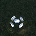 Modern Round LED Outdoor Lights Illuminated On Green Garden Grass
