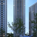 Modern High Rise Residential Building Exterior With Balconies And Green Trees In Urban Area
