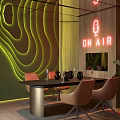 Modern Interior With Green Wavy Neon Wall ON AIR Sign Black Table Brown Chairs Plants
