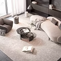 Modern Curved Sofa and Coffee Table Set With Armchair Rug Books and Decorations