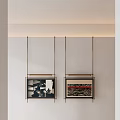 Minimalist Wall Featuring Hanging Framed Artworks With Brass Frames And Abstract Prints