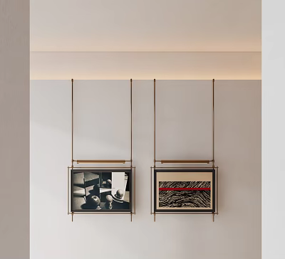 Minimalist Wall Featuring Hanging Framed Artworks With Brass Frames And Abstract Prints 3d model