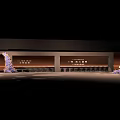 Modern Floral Display Design In Interior Space With Curved Structure Purple Flowers And Lighting Decoration