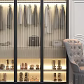 Elegant Hanging Clothes In Modern Wardrobe With Glass Doors Leather Bags Shoes And Tufted Armchair