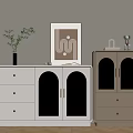 White And Beige Cabinets With Drawers Glass Doors And Decorative Items