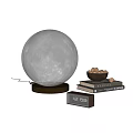 Realistic Moon Lamp on Wooden Base Beside Stacked Books Nut Bowl and Desk Decor