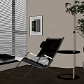 Modern Black Lounge Chair with Metal Frame Footrest and Side Table by Window with Blinds