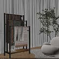 Modern Living Room With Black Metal Rack Displaying Colorful Patterned Throw Blankets And Green Plant