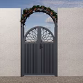 Black Arched Gate With Circular Lattice Design Green Plants Red Flowers And White Walls