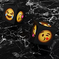 Black Emoji Dice With Fun Emoji Faces On Black Marble Surface