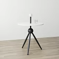 Modern Minimalist Side Table With Round White Tabletop Black Tripod Stand And Transparent Glass Cup