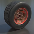 Car Tire With Black Tread Red Rim And Detailed Metal Texture Design