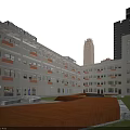 Modern School Building Exterior With Wide Campus Street And High Rise Buildings
