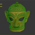 Intricate Golden Mask Sculpture With Detailed Carving Patterns And Decorative Top