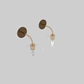 Modern Brass Wall Sconces With Clear Glass Globe Shades Mounted On Gray Wall