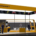 Continental Exhibition Booth With Yellow Canopy Tire Patterns People Tables Chairs And TV Screen