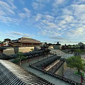 Ancient Architecture with Traditional Roofs Courtyard and City Wall Under Blue Sky