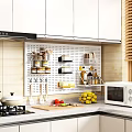Organized Kitchen With Perforated Board Holding Utensils Spice Jars Fresh Fruits On Countertop Microwave And Gas Stove