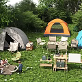 Outdoor Garden Landscape With Multiple Tents Green Grass Tables Chairs And Picnic Setup