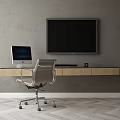 Modern Wooden Desk With Apple Computer Silver Chair And Large Screen TV On Gray Wall