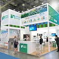 Sanquin Plasma Exhibition Booth With Green Backdrop Reception Desk And Screen