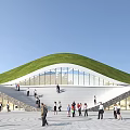 Popular Visitor Center With Green Roof Glass Facade And Steps For Tourists Gathering