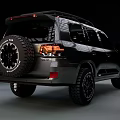 Dark Colored SUV With Off Road Tires Roof Rack And Rugged Exterior Design