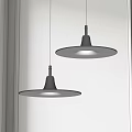 Modern Two Circular Black Pendant Lights Illuminated By Window With White Wall 3d model