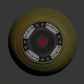 Green Round Military Weapon Featuring Orange Marks Red Central Symbol And Metal Parts
