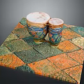 Traditional Ornate Decorative Hand Drums On Colorful Patterned Square Mat