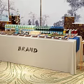 Elegant Brand Gourmet Display Table With Assorted Snacks Drinks And Landscape Backdrop