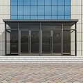 Modern Glass Entrance Door With Black Frame Awning Steps And Light Colored Facade
