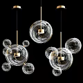 Modern Transparent Glass Pendant Lights With Golden Metal Accents And Spheres