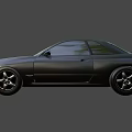 Gray Two Door Sports Car With Sleek Exterior Design And Alloy Wheels
