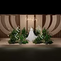 Elegant Wooden Sculpted Wedding Scene With White Dress Green Plants And Flowers