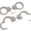 Two Stainless Steel Handcuffs With Key In Open And Closed States
