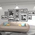 Photo Wall In Modern Living Room With Black And White Photos And Minimalist Sofa Decor