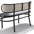 Modern Leisure Chair With Black Metal Frame And Woven Rattan Backrest Design