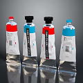 Art Color Paint Tubes With Red Blue Labels And Colorful Caps On Reflective Black Background