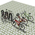 Parked Red and Green Bicycles on Brick Pavement with Bicycle Rack