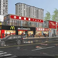 Busy Commercial Street With McDonald's Retail Stores High Rise Buildings Trees Vehicles And Pedestrians
