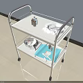 Two Tier Medical Trolley With Wheels Holding Medical Supplies And Instruments