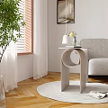 Modern Minimalist Side Table In Living Room With Grey Armchair Wooden Floor And Green Plant
